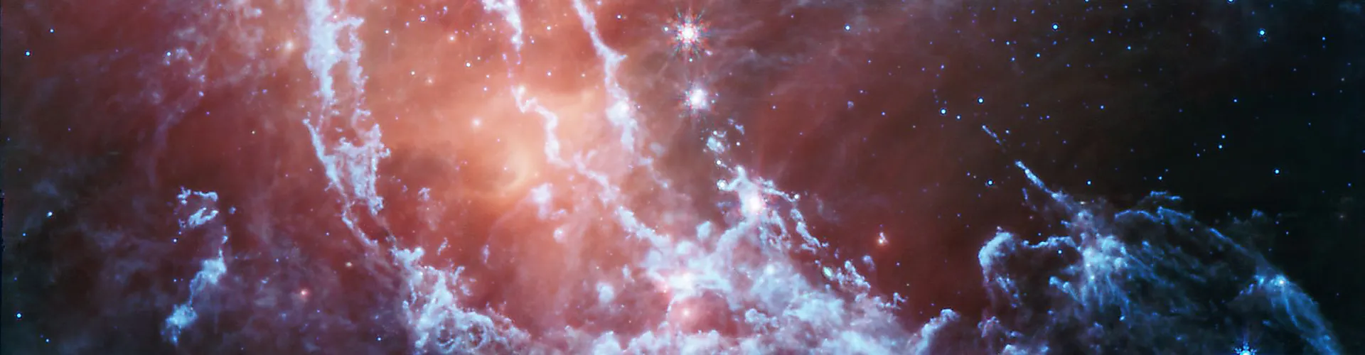 A starscape featuring a nebula